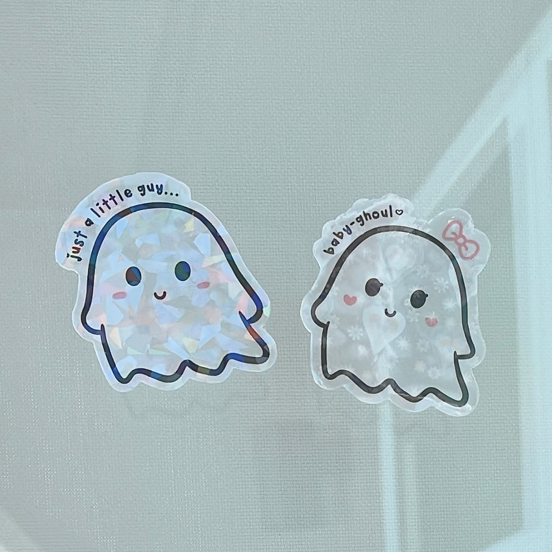 Little guy and his baby ghoul sticker